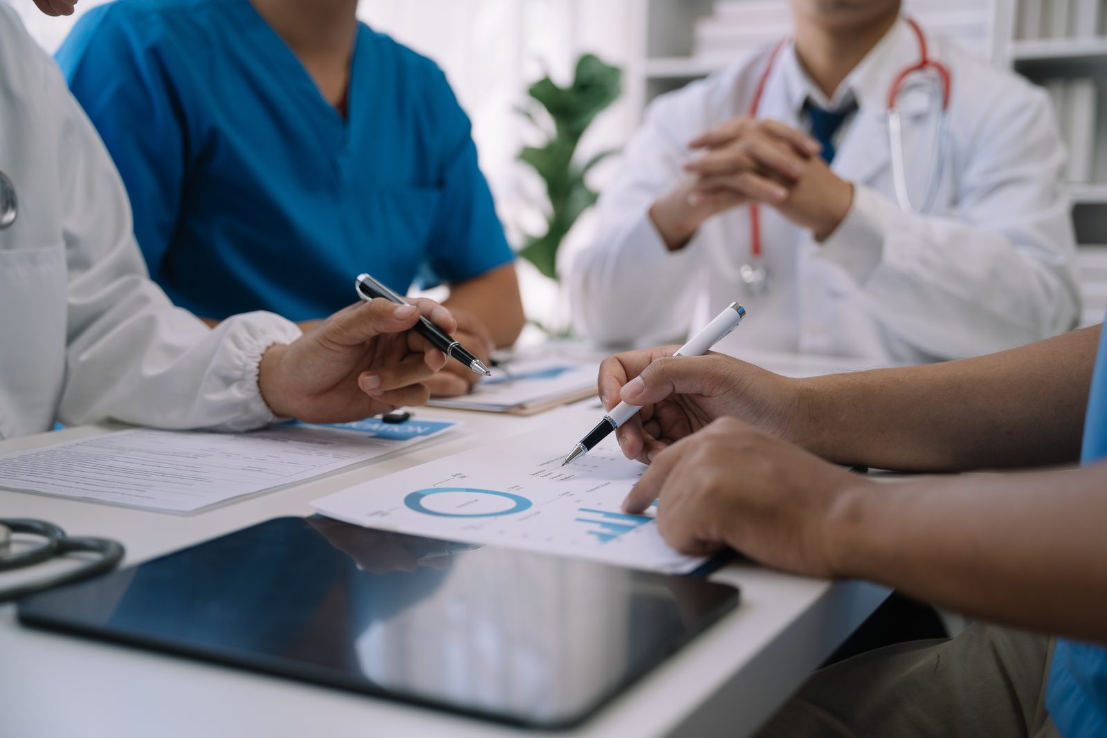 Medical professionals reviewing patient analytics and growth strategy